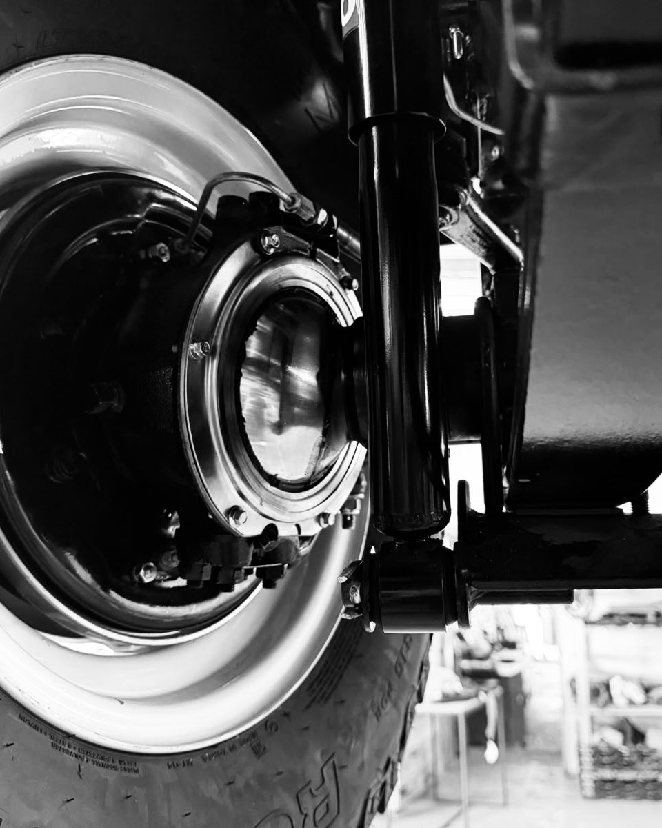 Black-and-white front view of the Westminster Series III through the workshop doorway