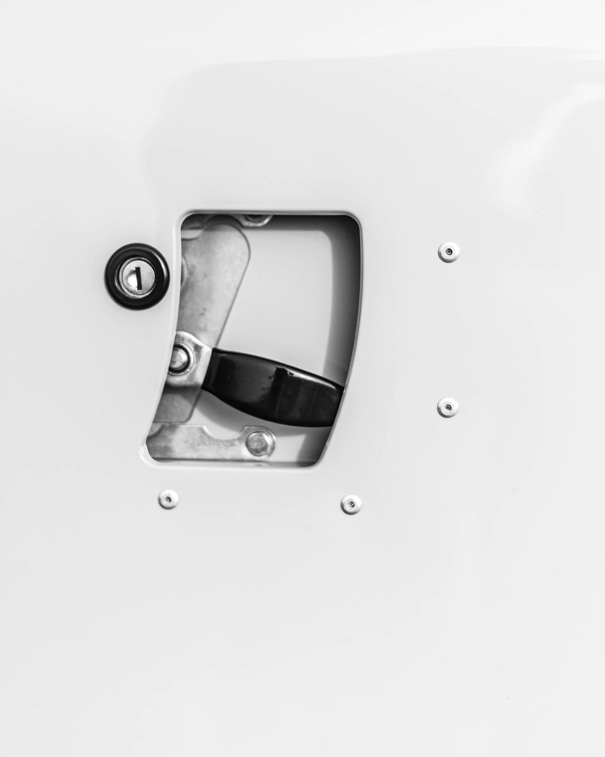 Close-up of a Defender door handle and riveted body panel