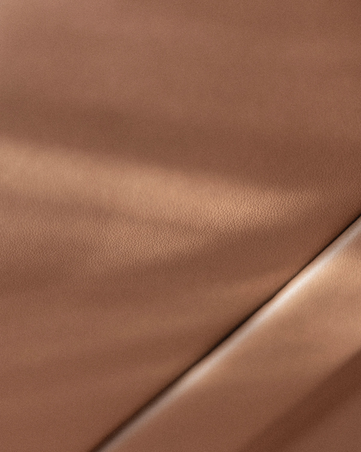 Close-up of terracotta leather upholstery and a finished seam in the Miami Blue Defender 110