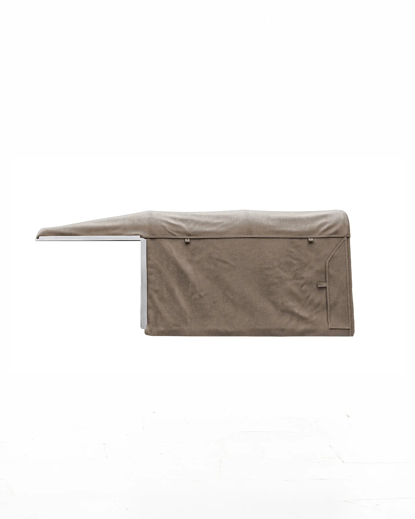 Side view of the handmade waxed-cloth soft top with its seams, straps and rear side panel