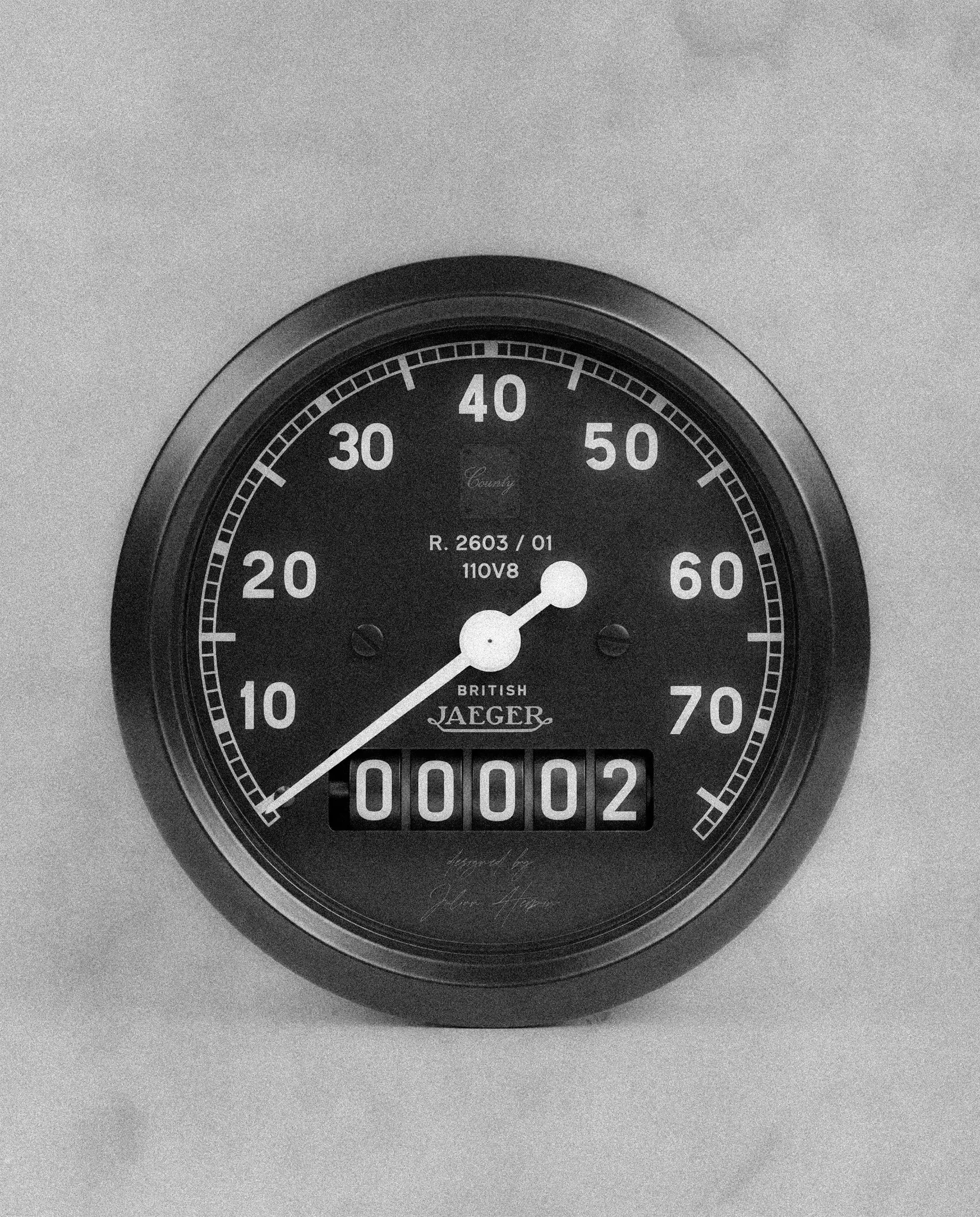 Monochrome instrument design study with a black dial and 110 V8 lettering