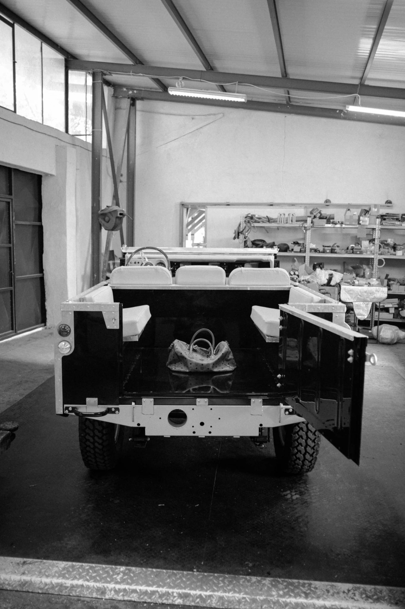 Black-and-white rear view of the open Westminster Series III in the workshop